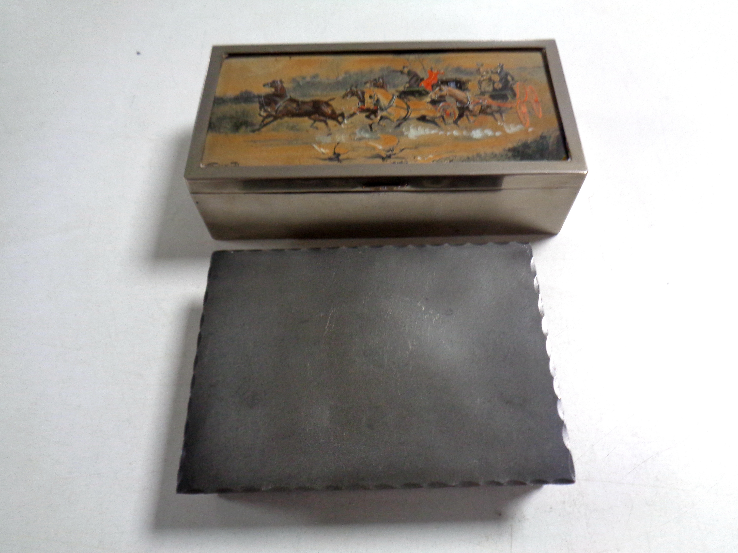 An Arts and Crafts Norwegian pewter cigarette box together with a Gilbert S.