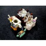 A tray containing four novelty teapots,