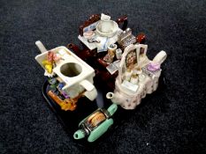 A tray containing four novelty teapots,