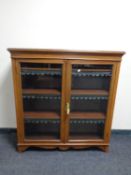 A 19th century inlaid mahogany double door bookcase