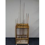 A Shakespeare twin sided fishing rod stand together with a quantity of split cane fly rods