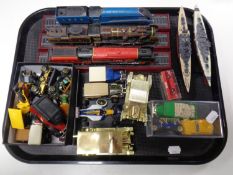 A tray containing assorted die cast vehicles, delivery vans,