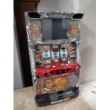 A Japanese table top electric fruit machine with key