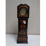 A 19th century pocket watch stand in the form of a grandfather clock together with a Smith's Empire