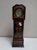 A 19th century pocket watch stand in the form of a grandfather clock together with a Smith's Empire