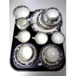 A tray containing twenty one piece oriental style Crown Staffordshire bone china tea service
