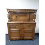 A 20th century carved oak buffet back sideboard