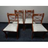 A set of four Regency style dining chairs