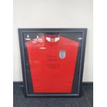 An England football shirt signed 'Best Wishes, Bobby Robson and Malcolm McDonald',