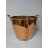 A brass and copper twin handled coal bucket
