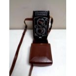 A vintage Franke and Heidecke Rolleiflex camera in leather case