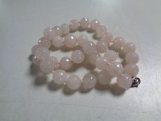 A rose quartz beaded necklace