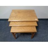 A nest of three 20th century teak Remploy tables