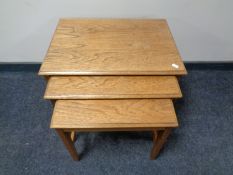 A nest of three 20th century teak Remploy tables