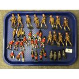 A tray of 20th century hand-painted die cast military figures including British marching troops in