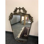 An ornate brass framed mirror,