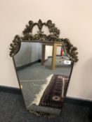 An ornate brass framed mirror,