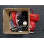 A box containing sporting equipment to include pair of signed boxing gloves,