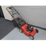 A MTD petrol self drive lawn mower with grass box