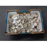 A box containing a large quantity of crested china