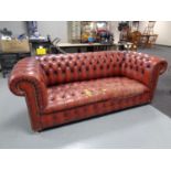 An oxblood Chesterfield deep button club settee (a/f)