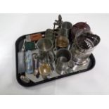 A tray containing cast iron pipe stand, a Bakelite tea caddy, assorted plates wares, hip flasks,
