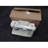 A JMB electric sewing machine with foot pedal in box