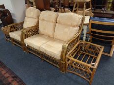 A bamboo and wicker two piece conservatory suite with matching coffee table (no glass)