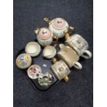 A tray containing a three piece Sadler tea service, a four piece Gibson tea service,