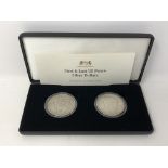 Two American silver dollars, The First and Last US Peace Silver Dollars, boxed with certificate.
