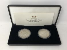 Two American silver dollars, The First and Last US Peace Silver Dollars, boxed with certificate.