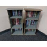 Two sets of narrow painted bookshelves