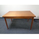 A 20th century teak extending dining table