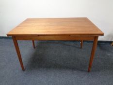 A 20th century teak extending dining table