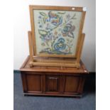 An oak blanket box together with a tapestry fire screen
