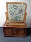 An oak blanket box together with a tapestry fire screen