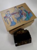 An antique ebonised letter rack depicting Japanese figures together with a Japanese trinket box in