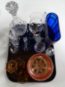 A tray of petrol glass bowl, decanter, amber glass dressing table pieces,