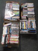 Four boxes containing a large quantity of DVDs and CDs,