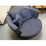 A cuddle chair upholstered in a blue fabric