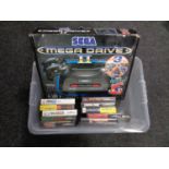 A boxed Sega Mega Drive 2 together with ten games to include Jurassic Park, Fifa, Rambo 3,