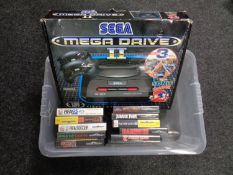 A boxed Sega Mega Drive 2 together with ten games to include Jurassic Park, Fifa, Rambo 3,