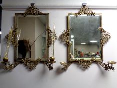 A pair of antique ornate brass framed bevel edged mirrors with candle sconces (as found)