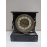 A 19th century marble and black slate mantel clock with brass and enamel dial