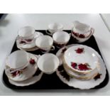 A tray containing a twenty one piece Royal Vale bone china tea service