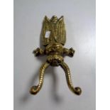 A Victorian brass beetle boot jack