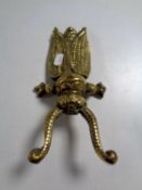 A Victorian brass beetle boot jack