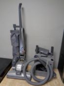 A Kirby Micron Magic upright vacuum with a large quantity of accessories