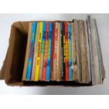 A box containing 20th century Beano and Dandy annuals together with vintage Practical Mechanics