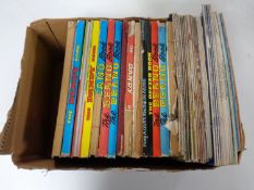 A box containing 20th century Beano and Dandy annuals together with vintage Practical Mechanics